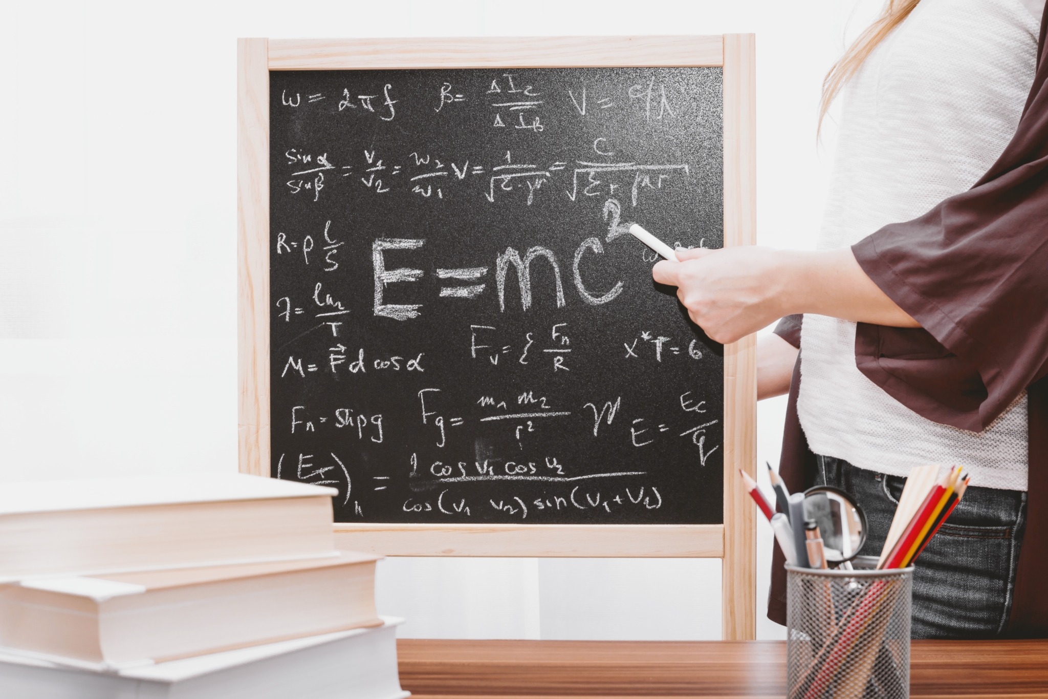 Chalkboard full of equations including E=MC2